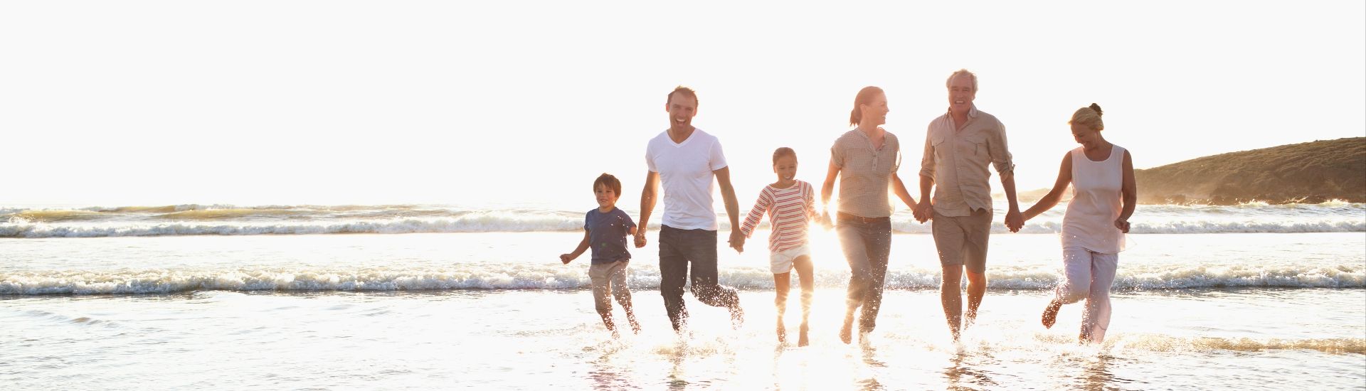 Family walk on beach